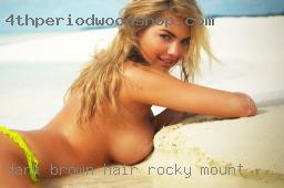 Dark Rocky Mount brown hair shoulder length.
